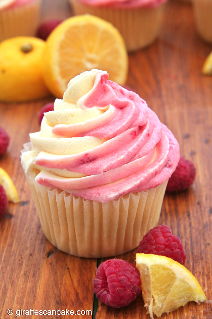  Raspberry Lemon Cupcakes by Giraffes Can Bake - Moist and tart lemon cupcakes filled with smooth lemon curd and topped with Lemon Raspberry Swirl Buttercream Frosting