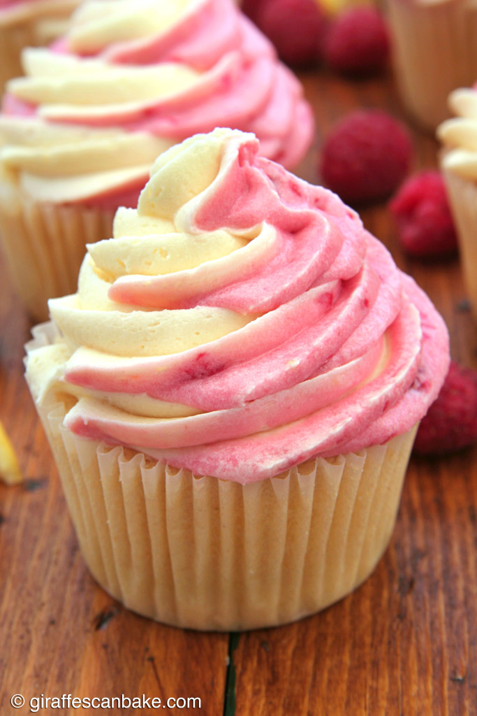 Raspberry Lemon Cupcakes by Giraffes Can Bake - Moist and tart lemon cupcakes filled with smooth lemon curd and topped with Lemon Raspberry Swirl Buttercream Frosting
