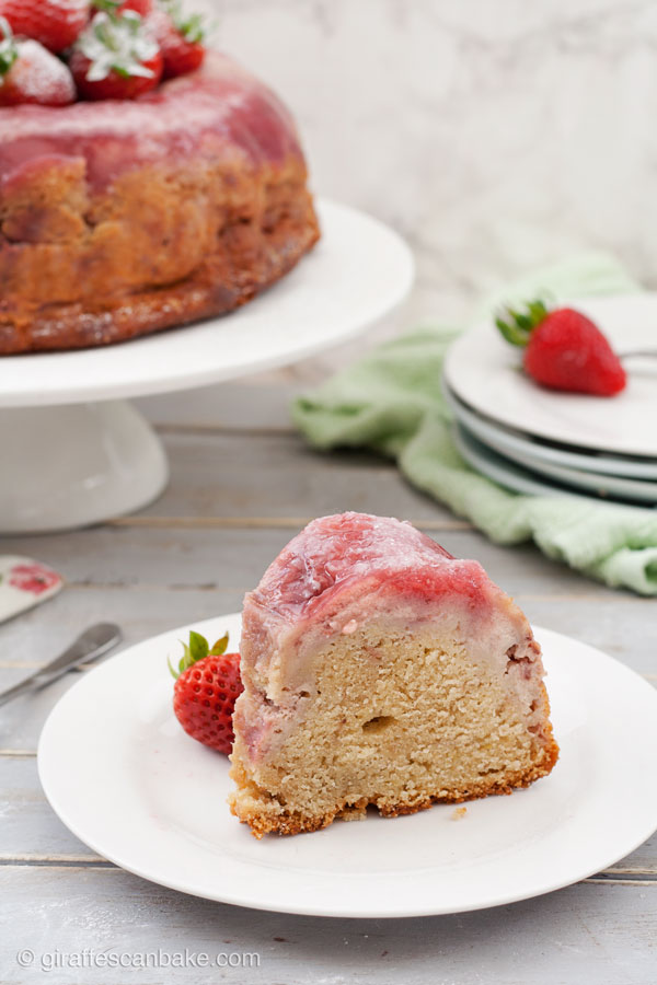 Strawberry Cheesecake Upside Down Bundt Cake - a delicious and moist yogurt cake with creamy strawberry cheesecake and fresh strawberries baked right into it. So easy, so yummy and perfect for summer! #YumOfTheMonth #YOTM
