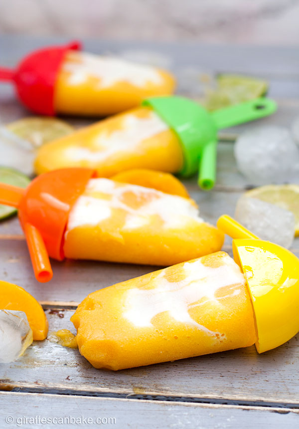 Peaches 'n' Cream Margarita Popsicles -Creamy and fruity, with just a hint of tequila - these Peaches 'n' Cream Margarita Popsicles are really easy to make and are the perfect treat for Cinco de Mayo and all summer long!
