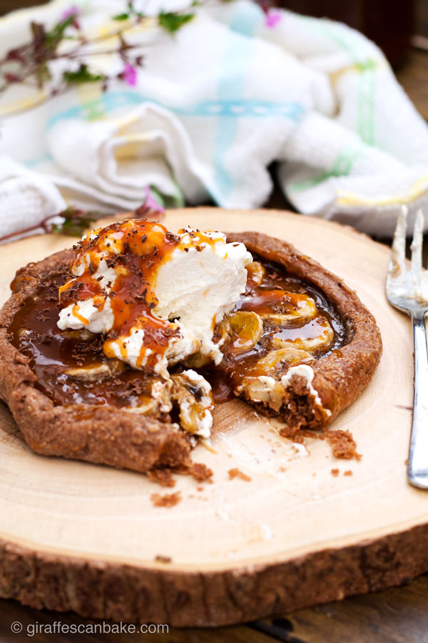 Banana and Salted Caramel Banoffee Galettes - A sinfully indulgent rustic free-form tart. Chocolately pastry is home to sweet bananas and salted caramel, topped with fresh whipped cream and grated chocolate. So simple to make with 5 minute caramel sauce, you won't regret making this!