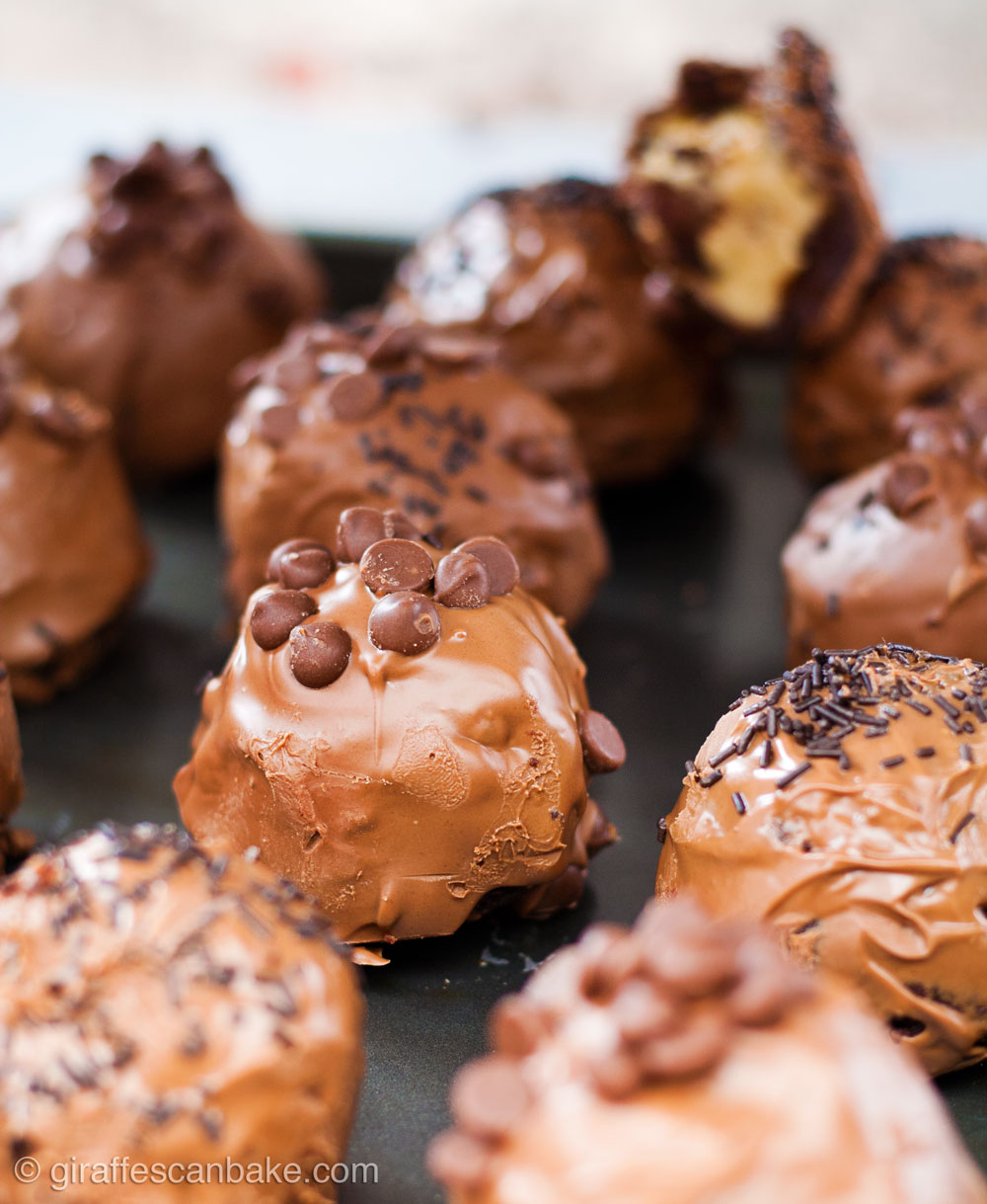 Gluten Free Cookie Dough Brownie Bombs with Salted Caramel - a group of brownie bombs, the focus is on the middle brownie bomb