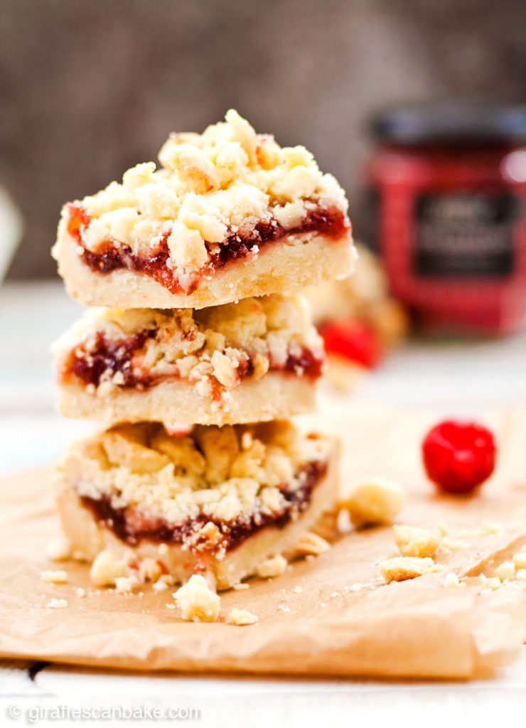 Jam Shortbread Cookie Bars - Buttery, melt in your mouth shortbread, smothered in sweet, fruity jam and topped with even more buttery goodness in the form of shortbread streusel. These Jam Shortbread Cookie Bars are the most delicious cookie bar you will ever eat. They are gluten free, ridiculously quick and easy to make, and so yummy you won’t believe it!