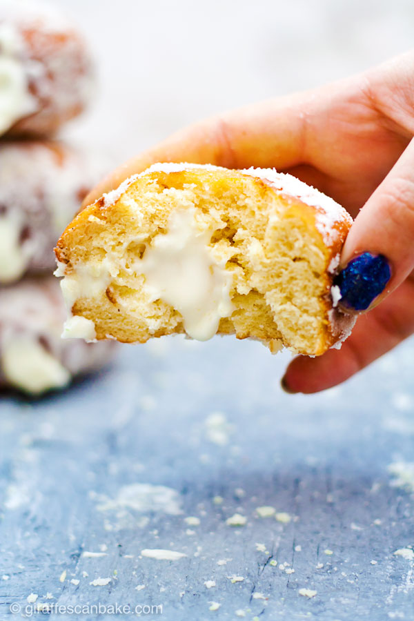 Gluten Free Yeast-Raised Margarita Cheesecake Donuts - fluffy, delicious and so easy! This amazing recipe also includes all my tips on how to make perfect gluten free yeast-raised donuts every time. Plus a FREE cheat sheet printable! - a donut with a bite taken out of it, showing the fluffy inside