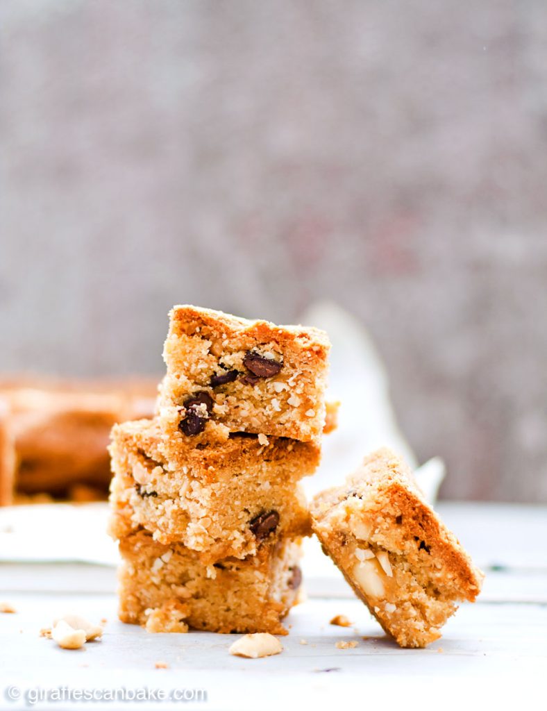 Gluten Free Triple Peanut Blondies - Chewy, moist and packed full of delicious peanut goodness. A peanut butter lover's dream come true! - A tower of three blondies