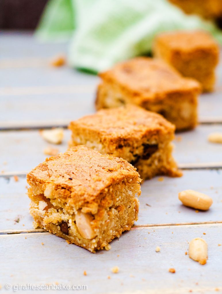 Gluten Free Triple Peanut Blondies - Chewy, moist and packed full of delicious peanut goodness. A peanut butter lover's dream come true! - A diagonal line of four blondies